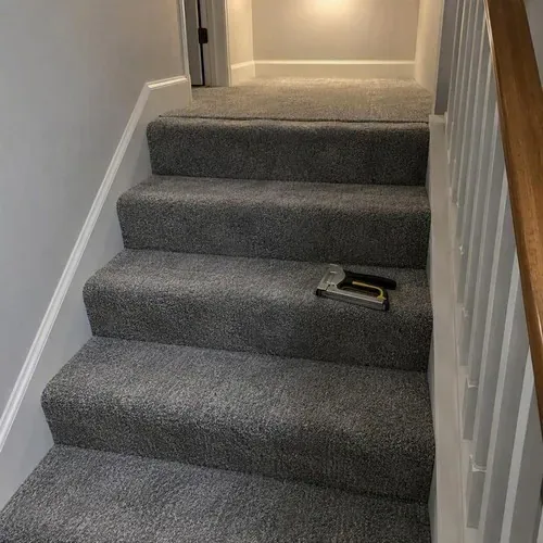 New gray carpet installed on staircase and landing after carpet installation