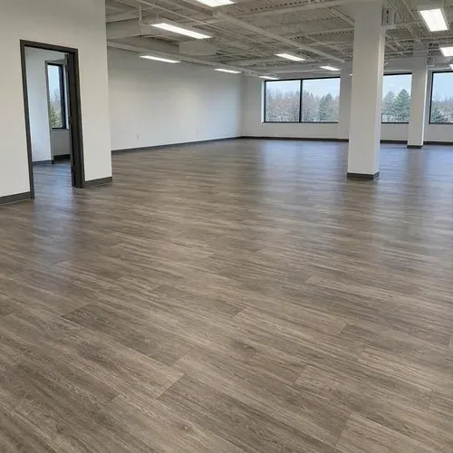 Finished luxury vinyl tile in open office after commercial flooring installation