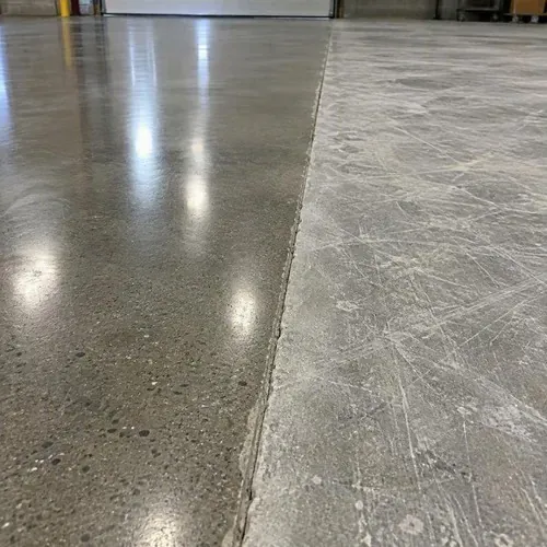 Polished concrete section meeting dull unpolished section after concrete polishing and coating