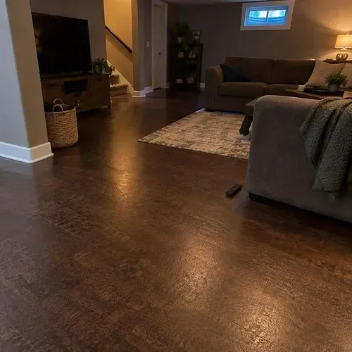 Finished dark-stained cork floor in basement after cork floor installation