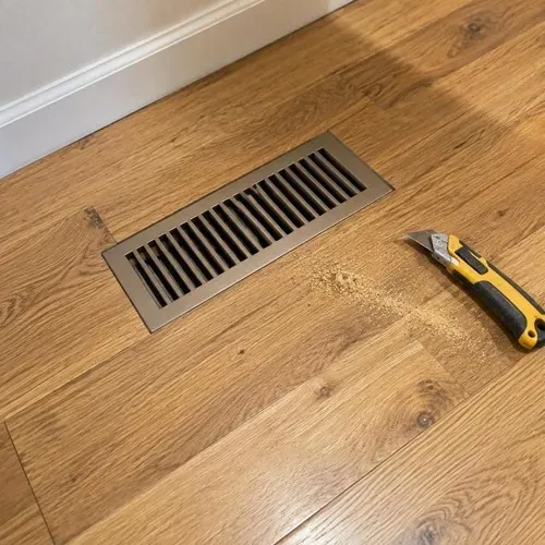 New hardwood with flush floor vent cut in after hardwood floor installation