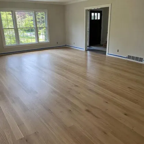 Matte refinished white oak floor in empty room after hardwood floor sanding and refinishing