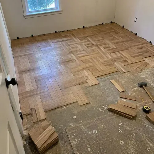 Basket-weave parquet pattern half finished during herringbone and parquet floor installation