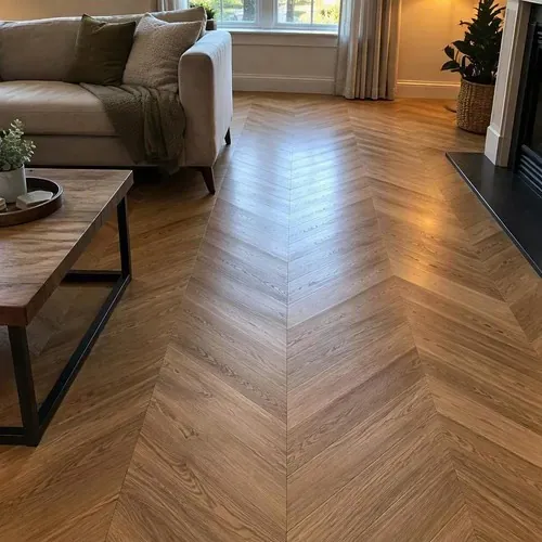Finished herringbone wood floor in cozy living room after herringbone and parquet floor installation